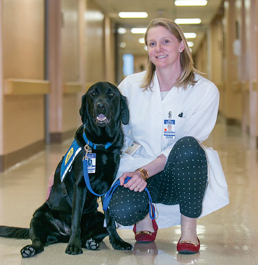 Facility dog Banjo and Calvary Social Worker