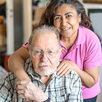 Elderly man and caregiver