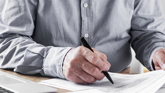 Man signing document